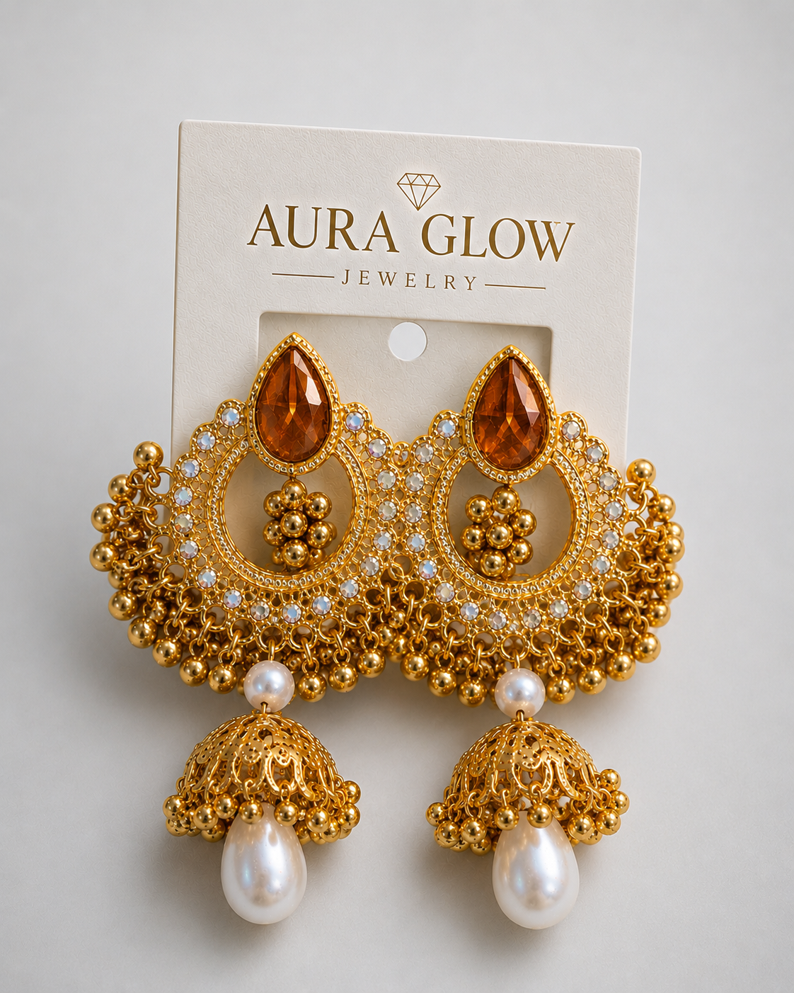 Aura Glow Amber Stone Pearl Gold Plated Designer Jhumka Earrings